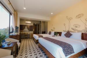 Ein Bett oder Betten in einem Zimmer der Unterkunft Tam Coc Lion Kings Hotel & Resort