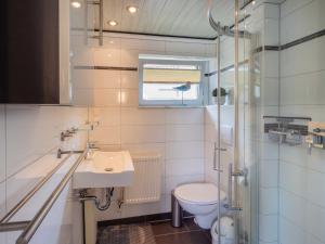 a small bathroom with a toilet and a sink at Ferienhaus Smerzinski in Bergen auf Rügen