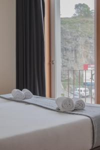 Llit o llits en una habitació de Spot Apartments Sao Bento