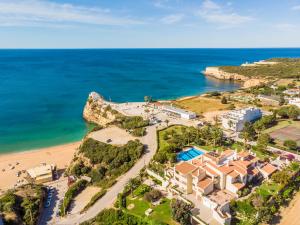 an aerial view of a resort and the ocean at Quinta das Palmeiras Pool & Beach in Pêra in Porches