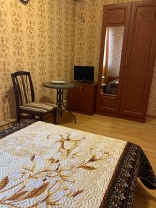 Lova arba lovos apgyvendinimo įstaigoje Guest House Uyut