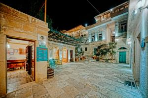 an empty courtyard in a building at night at Elysee Cave House in Göreme