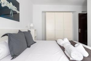 Posteľ alebo postele v izbe v ubytovaní FUN BUILDING PENTHOUSES by HOMEABOUT