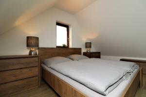 Posteľ alebo postele v izbe v ubytovaní Horské apartmány Na Pastvinách