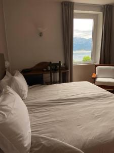 Posteľ alebo postele v izbe v ubytovaní Hotel Lenno