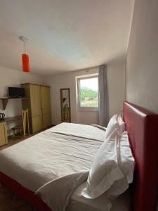 Posteľ alebo postele v izbe v ubytovaní Hotel Lenno