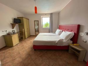 Posteľ alebo postele v izbe v ubytovaní Hotel Lenno