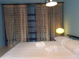 En eller flere senge i et værelse på Above Ljubljanica River Apartment