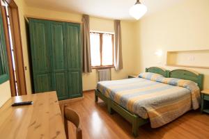 Postel nebo postele na pokoji v ubytování Albergo Bucaneve