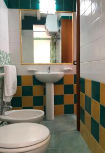 Koupelna v ubytování Residence Il Melograno