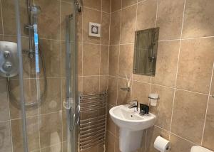 a bathroom with a sink and a shower at Church House Farm in Danby +45 photos