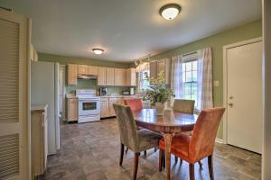 a kitchen with a wooden table and chairs in a room at Horse Country House, 6 Mi to KY Horse Park! in Lexington