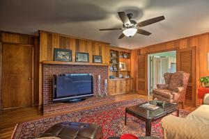 a living room with a fireplace and a tv at Horse Country House, 6 Mi to KY Horse Park! in Lexington