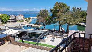 a house with a view of the water at Boutique Resort Villa VISTA in Malinska