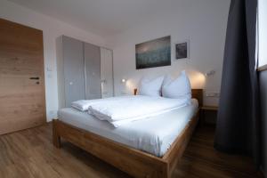 Posteľ alebo postele v izbe v ubytovaní Apartment Nora
