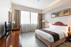 Un pat sau paturi într-o cameră la Jinling Mansion Nanjing
