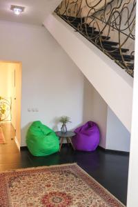 a living room with two bean bags and a table at Хутор-city in Korostyshiv