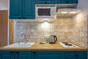 Kjøkken eller kjøkkenkrok på DayFlat Apartments Olimpiyska Area