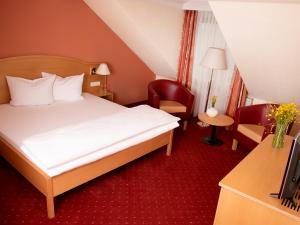 Ein Bett oder Betten in einem Zimmer der Unterkunft ANETSEDER Landhotel & Lofts