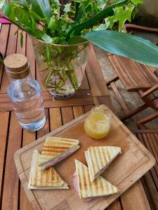 a cutting board with crackers and a lemon on a table at B&B Altè in Paderno del Grappa