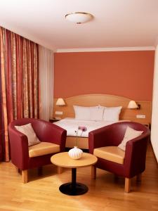 Ein Sitzbereich in der Unterkunft ANETSEDER Landhotel & Lofts
