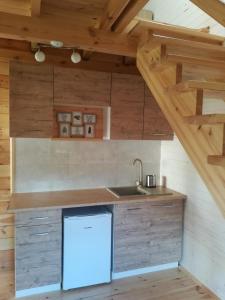 Kuchyň nebo kuchyňský kout v ubytování Domek pod jabłonią Mikoszewo