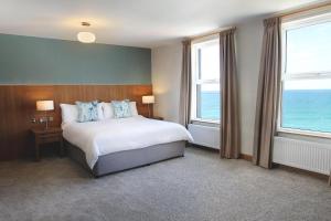 Cama ou camas em um quarto em Esplanade Hotel