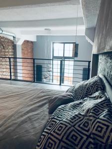 Säng eller sängar i ett rum på Loft De Girarda