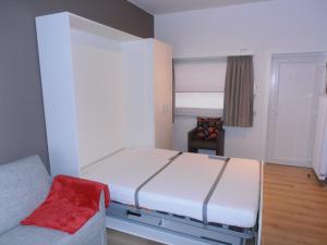 
A bed or beds in a room at Royal Beach, vernieuwde studio aan het strand, Knokke-Heist
