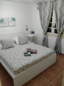 Postel nebo postele na pokoji v ubytování Luce & Relax per Casa Arcobaleno
