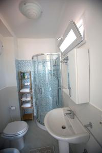 a bathroom with a shower and a sink and a toilet at da Letizia in Procida