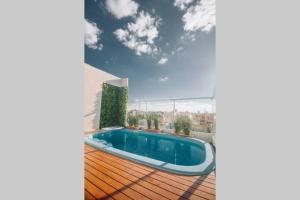 a house with a swimming pool on a deck at N4A2 - New, Nice, for Long and Short Stay in Asuncion