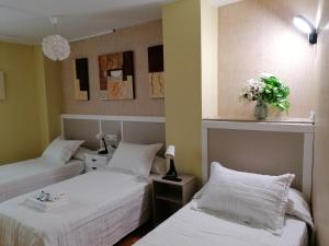 Кровать или кровати в номере Cuatro Caminos