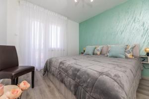 Postel nebo postele na pokoji v ubytování Apartman Gržetić