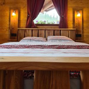 Ein Bett oder Betten in einem Zimmer der Unterkunft Planinska kuća "Sedam Vlašića"