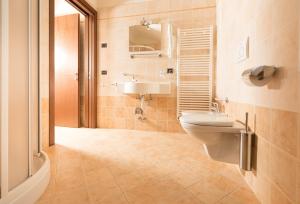 a bathroom with a sink and a toilet at Chalet Kiara - Appartamenti Abar in Livigno +79 photos