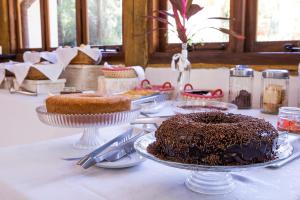 a table with a chocolate cake on top of it at Pousada Refugio da Harmonia in Ilhabela