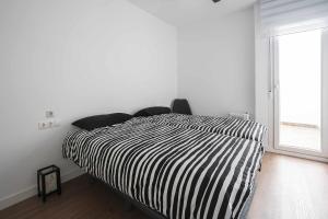 Postel nebo postele na pokoji v ubytování Casa Barrio San Antón Playa del Postiguet