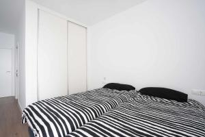 Postel nebo postele na pokoji v ubytování Casa Barrio San Antón Playa del Postiguet