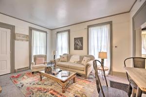 a living room with a couch and a table at Romantic Apt Near Wineries, Golf and Lake Erie! in Westfield