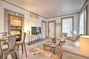 a living room with a couch and a table at Romantic Apt Near Wineries, Golf and Lake Erie! in Westfield