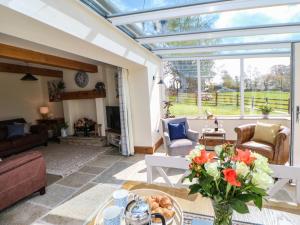 a conservatory living room with a glass ceiling at West Reins in Barnard Castle