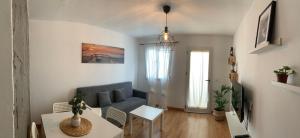 a living room with a couch and a table at Apartamento meria playa blanca in Playa Blanca