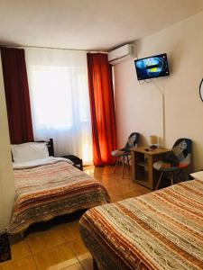 Postel nebo postele na pokoji v ubytování Vila Albatros + 37 fotografií