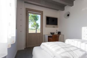 Agriturismo Redó客房内的一张或多张床位