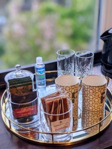 a tray with alcohol and glasses on a table at The Franklin in Harrogate