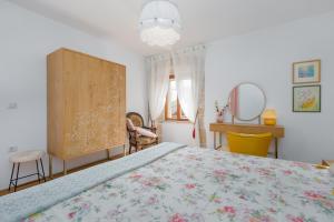 a bedroom with a large bed and a dresser at Casa Jagoda in Višnjan +30 photos