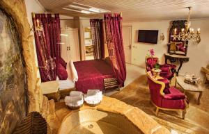 a living room with a bed and two chairs at Lethe Exclusive Hotel in Ağva