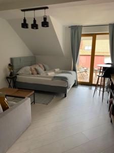 Postel nebo postele na pokoji v ubytování Nova Apartamenty Rewa