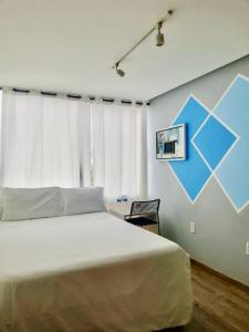 Postel nebo postele na pokoji v ubytování Kubo Hotel